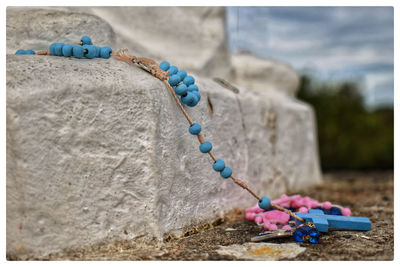 Close-up of wedding rings on rock