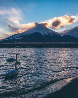 Scenic view of lake against sky during sunset