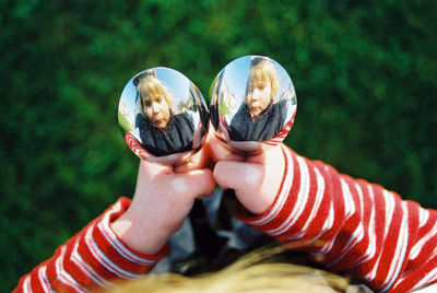 Reflection of girl in glasses