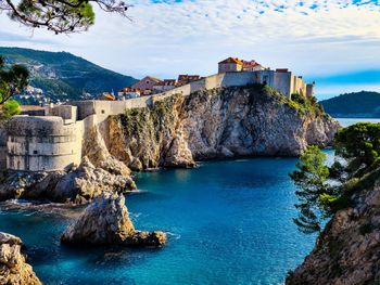 The walls of dubrovnik overlooking the adriatic.