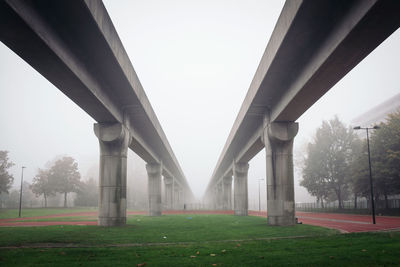 Railway bridge against sky in foggy weather at bijlmermeer