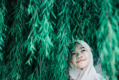 Close-up portrait of a smiling young woman