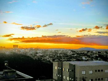 High angle view of townscape against sky at sunset