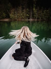 Rear view of woman in lake