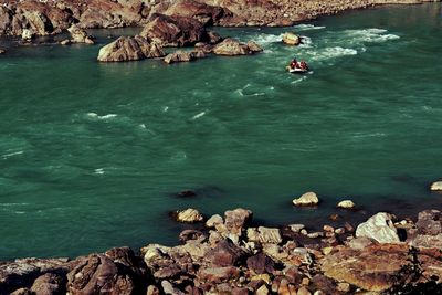 High angle view of rocks in sea