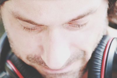 Close-up portrait of a man with eyes closed