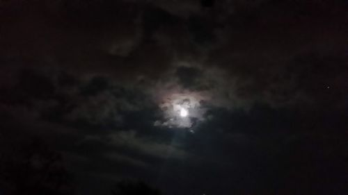 Low angle view of moon in sky at night