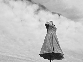 Dress on mannequin against clouds