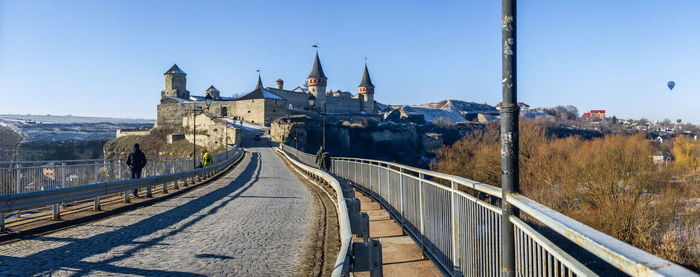 Panoramic view of the castle bridge to kamianets-podilskyi fortress on a sunny winter morning