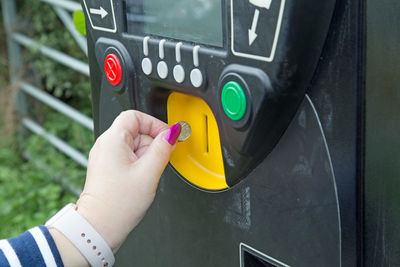 Close-up of hand holding camera