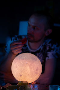 Portrait of young man holding camera