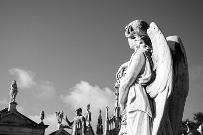 Low angle view of statue against sky