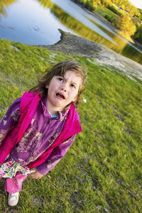 Portrait of crying girl on grass