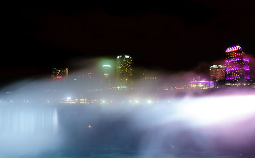 View of city lit up at night