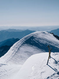 Scenic view of snow covered mountain against sky