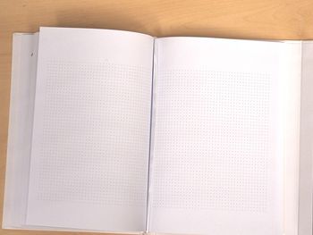 High angle view of open book on table
