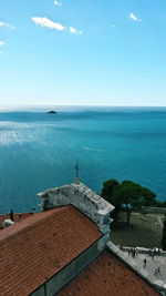 High angle view of building by sea against sky