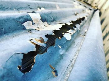High angle view of rusty metal on snow