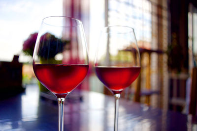 Close-up of wineglasses on table