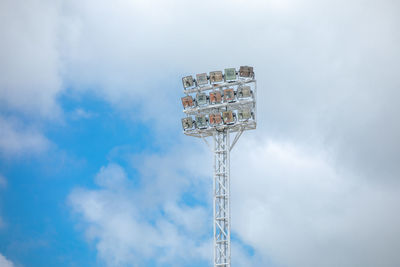 Low angle view of communications tower against sky