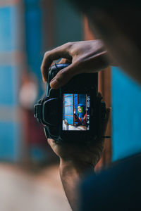 Close-up of person photographing