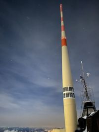 Low angle view of smoke stack against sky