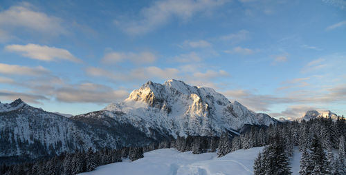 Scenic view of snowcapped mountains against sky