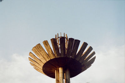 Low angle view of ferris wheel against sky