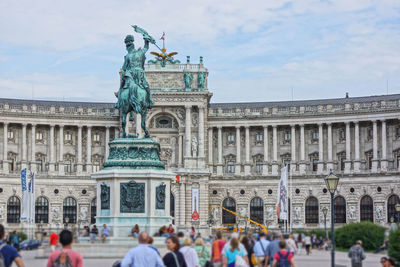 People in front of historic building