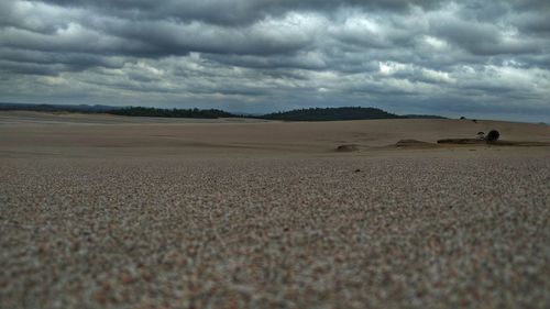 Scenic view of landscape against cloudy sky