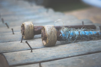 Close-up of rusty metal on table