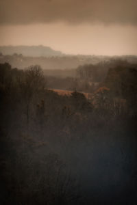 Scenic view of landscape against cloudy sky