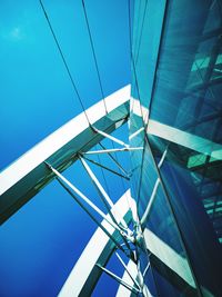 Low angle view of bridge against blue sky