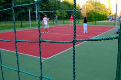 People playing soccer on field