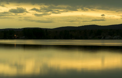 Scenic view of lake against sky during sunset