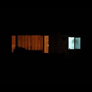 Empty corridor in building at night