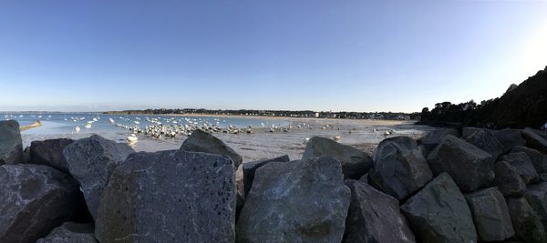 Panoramic view of sea against clear blue sky