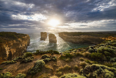 Tom and eva look out on the australian coast at the twelve apostles