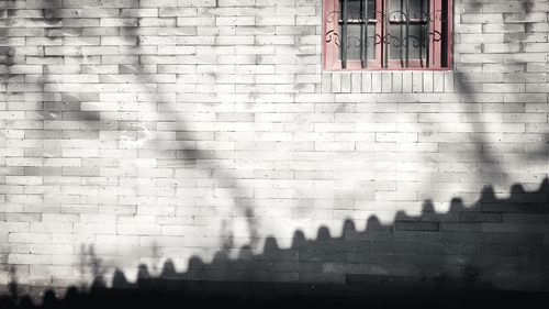 Shadow of window on wall of building