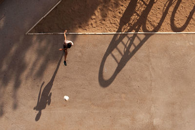 High angle view of man playing with ball