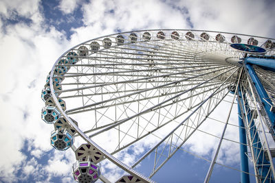 Low angle view of ferris wheel against sky