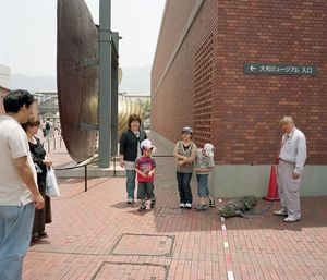 People on sidewalk in city