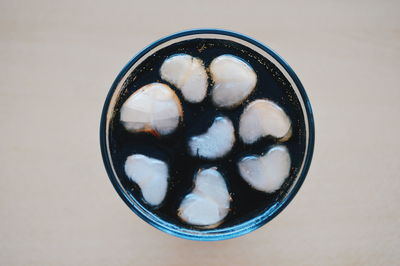 Close-up of ice in drink on table