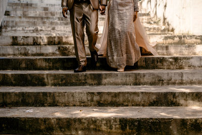 Low section of woman standing on steps