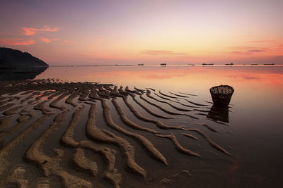 Scenic view of sea against sky at sunset