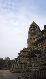 Old temple building against sky