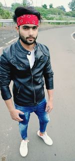 Portrait of young man standing outdoors