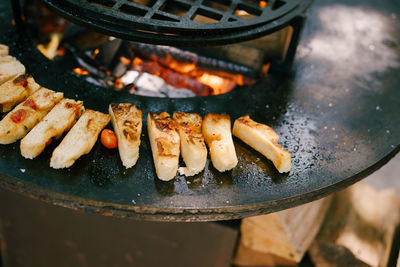 High angle view of meat on barbecue