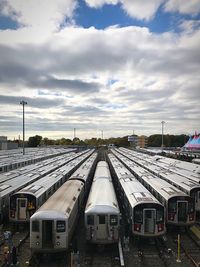 Train on railroad tracks against sky