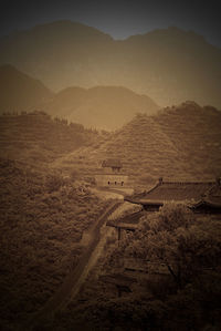 High angle view of land and mountains against sky